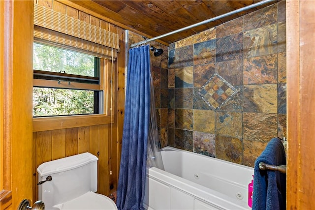 bathroom with wood walls, wood ceiling, shower / bath combo, and toilet