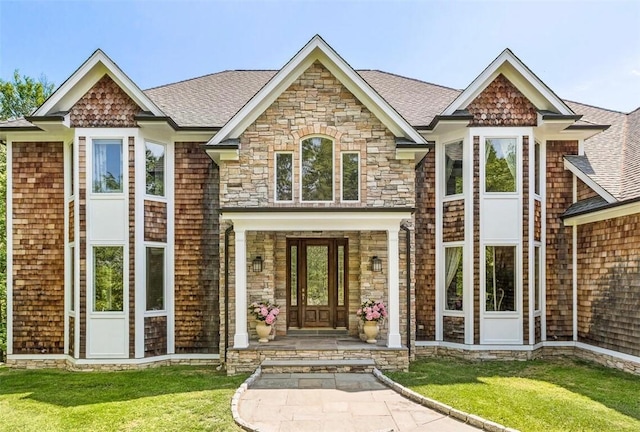 view of front of home featuring a porch and a front yard