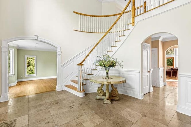 staircase featuring crown molding and hardwood / wood-style flooring