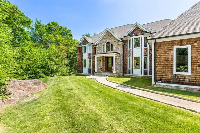 view of front of home with a front lawn