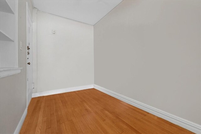 unfurnished room featuring wood-type flooring