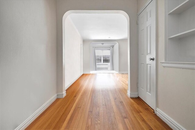 corridor featuring light hardwood / wood-style floors