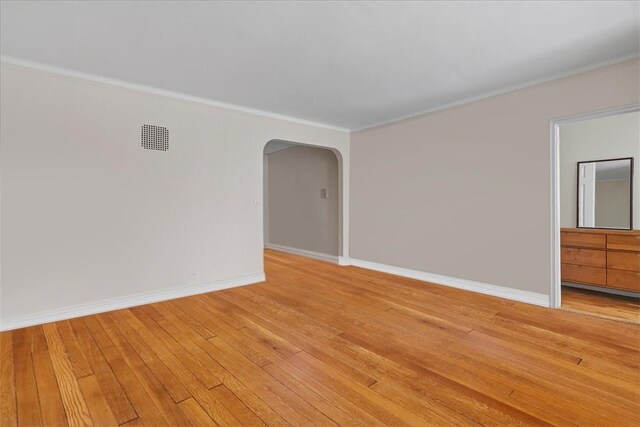 spare room with light hardwood / wood-style floors