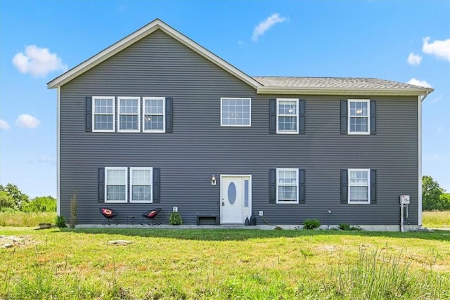 view of front of home with a front lawn