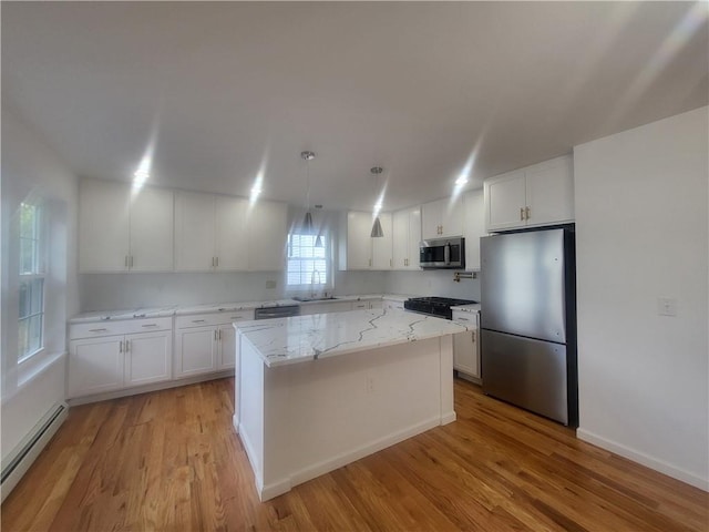 kitchen with a center island, stainless steel appliances, a baseboard radiator, light hardwood / wood-style flooring, and white cabinets