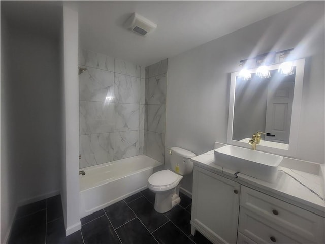 full bathroom featuring tile patterned floors, vanity, toilet, and tiled shower / bath