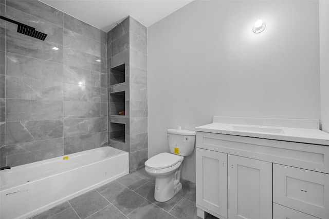 full bathroom featuring toilet, tile patterned floors, vanity, and shower / bathtub combination