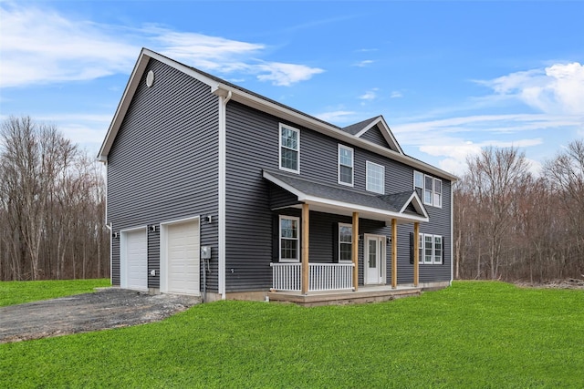 view of front of home with a porch, driveway, an attached garage, and a front lawn