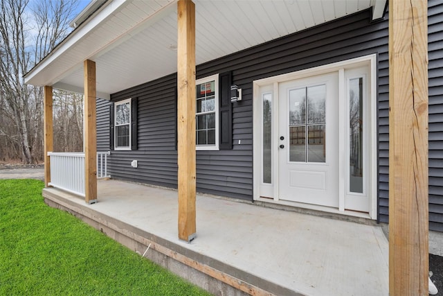 entrance to property featuring covered porch
