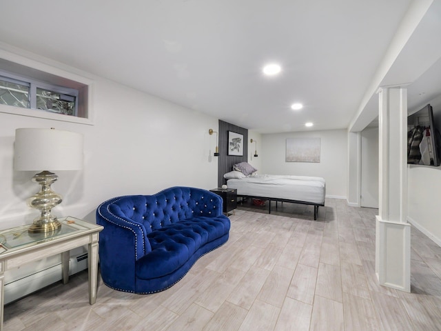 bedroom featuring light hardwood / wood-style flooring and a baseboard radiator