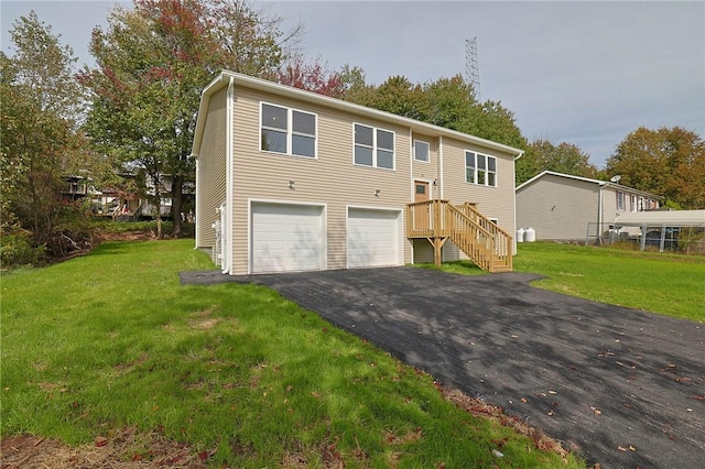 split foyer home with a front yard and a garage