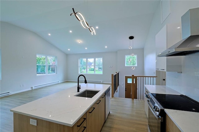 kitchen featuring a kitchen island with sink, sink, wall chimney exhaust hood, appliances with stainless steel finishes, and a baseboard radiator