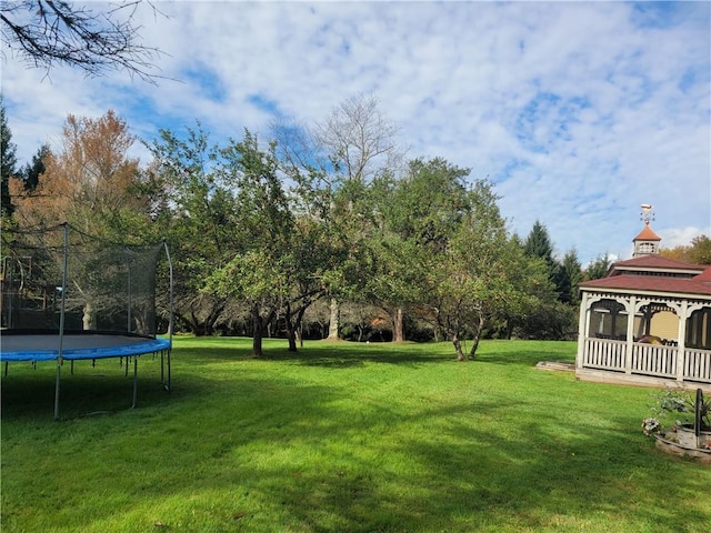 view of yard with a gazebo and a trampoline