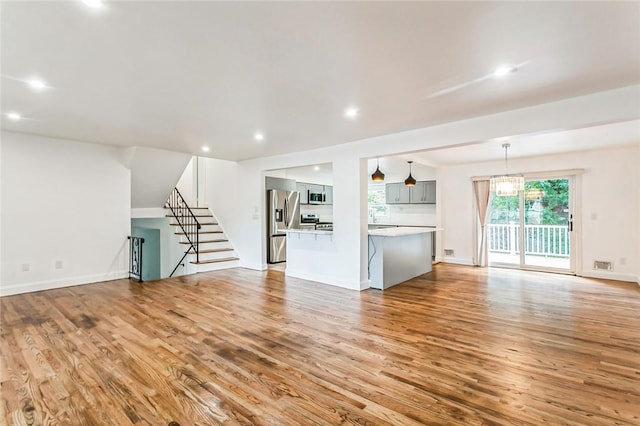 unfurnished living room featuring light hardwood / wood-style floors