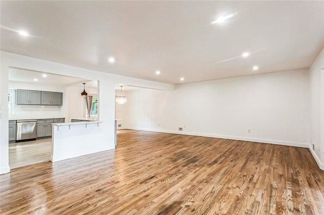 unfurnished living room with light hardwood / wood-style floors