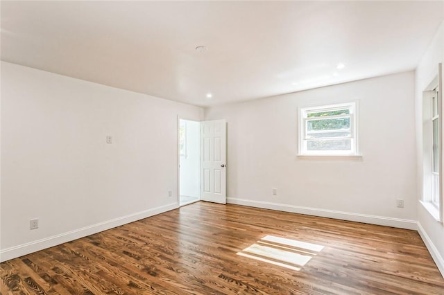 spare room with hardwood / wood-style flooring