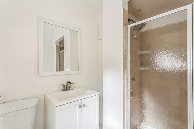 bathroom with vanity, toilet, and walk in shower