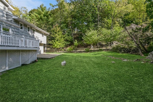 view of yard with a wooden deck