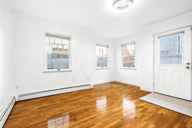 interior space featuring hardwood / wood-style floors and a baseboard radiator