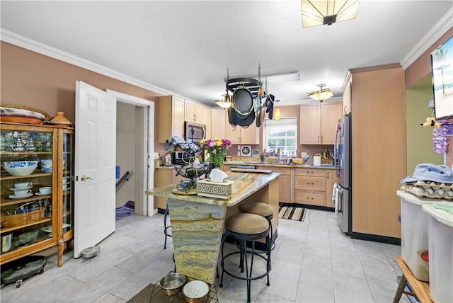 67 Myers Corners Rd, Wappingers Falls, NY 12590 - kitchen with stainless steel appliances, crown molding, a breakfast bar, a center island, and light stone countertops