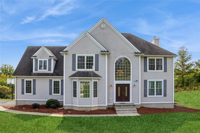 view of front facade featuring french doors and a front yard