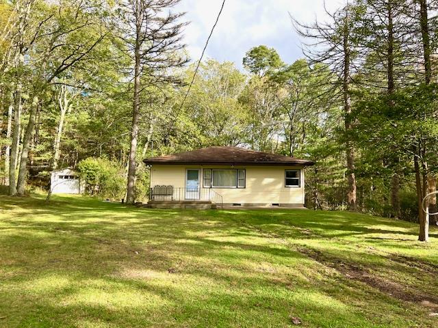 rear view of house with a lawn