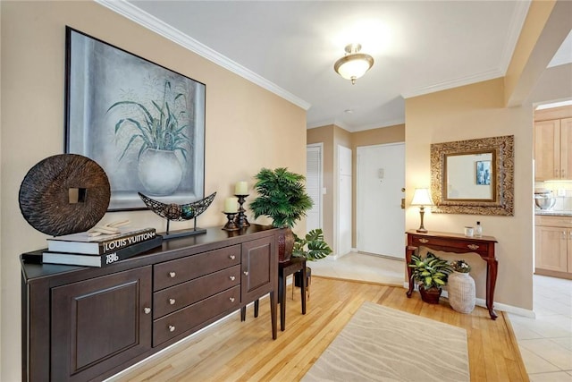 interior space with light hardwood / wood-style floors and ornamental molding