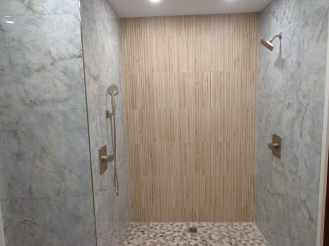 bathroom with a tile shower