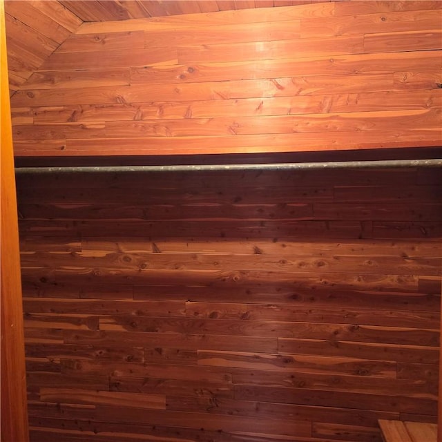 room details featuring wood walls and wood ceiling