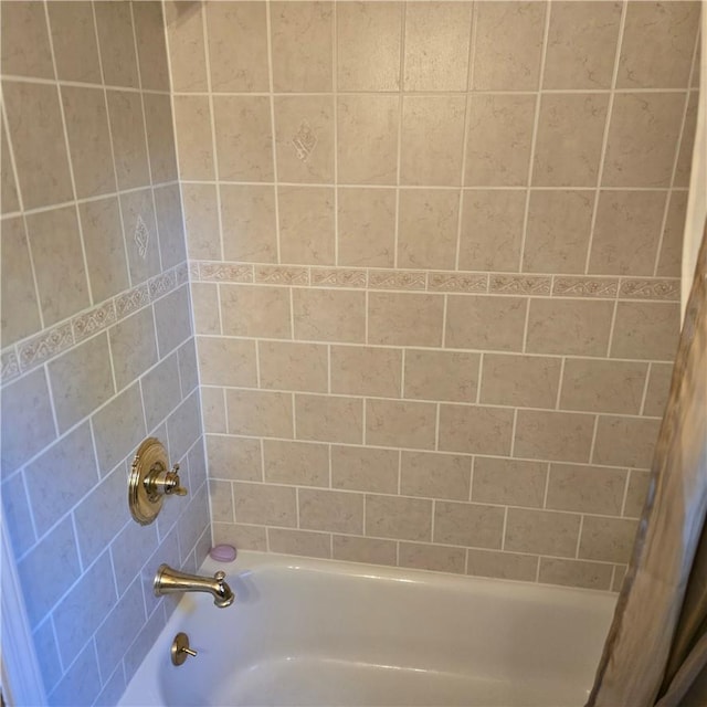 bathroom with shower / tub combo