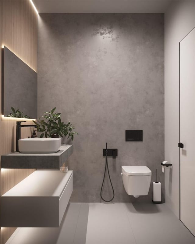 bathroom with tile patterned floors, toilet, and sink