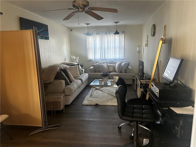 living room with ceiling fan and dark hardwood / wood-style floors