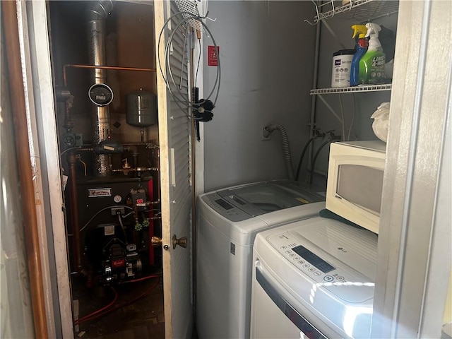 clothes washing area with washer and dryer