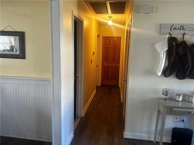 corridor with dark hardwood / wood-style floors