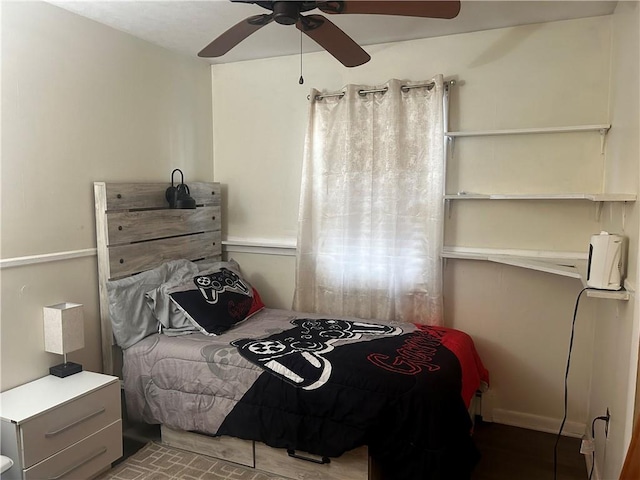 bedroom with hardwood / wood-style flooring and ceiling fan