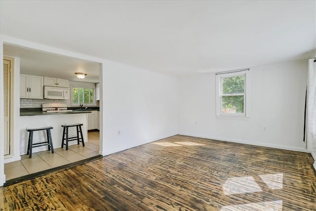 spare room with light hardwood / wood-style floors