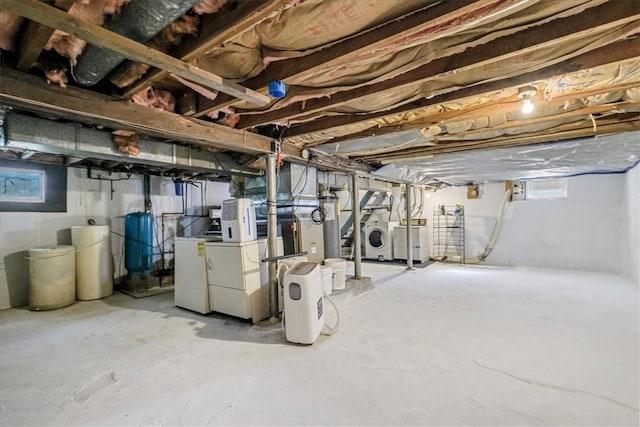 basement with washer and dryer and gas water heater