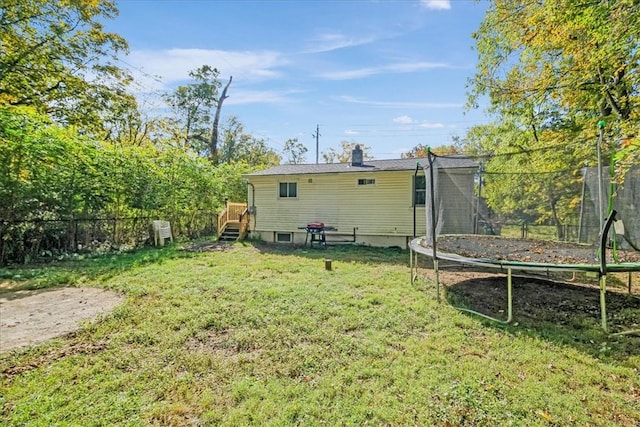 view of yard with a trampoline