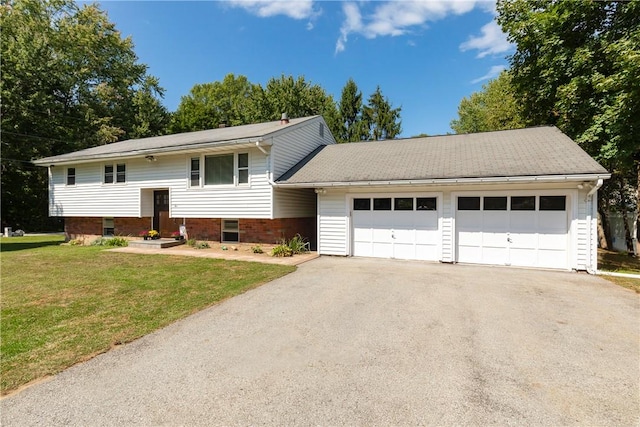 bi-level home featuring a front yard and a garage