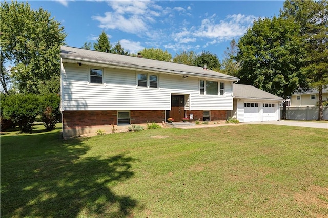 bi-level home featuring a front yard and a garage