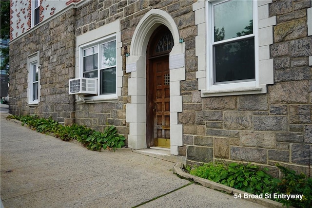 view of exterior entry featuring cooling unit