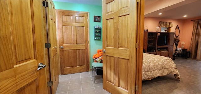 bedroom featuring light tile patterned flooring