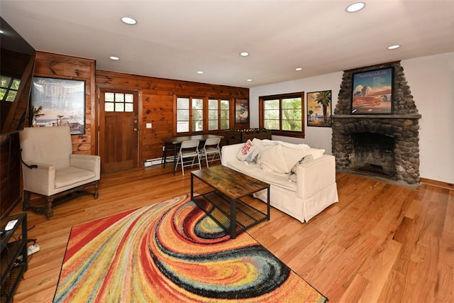 living room featuring a fireplace and wood-type flooring