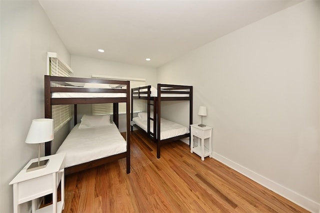 bedroom with wood-type flooring