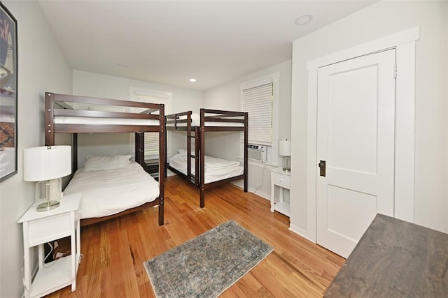 bedroom with hardwood / wood-style floors