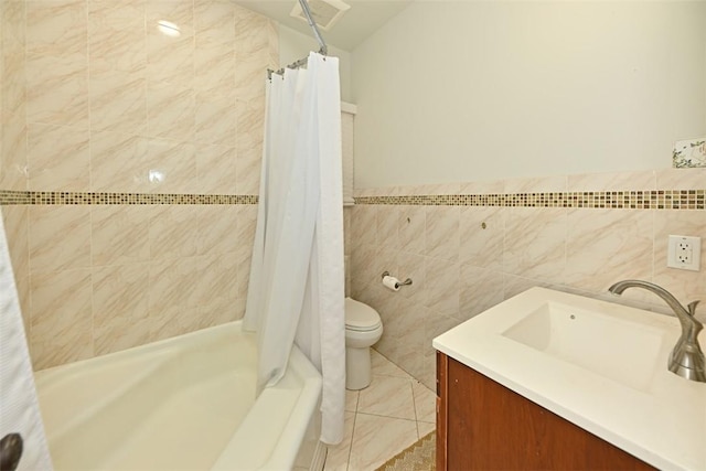 full bathroom with tile patterned flooring, vanity, shower / bathtub combination with curtain, and tile walls