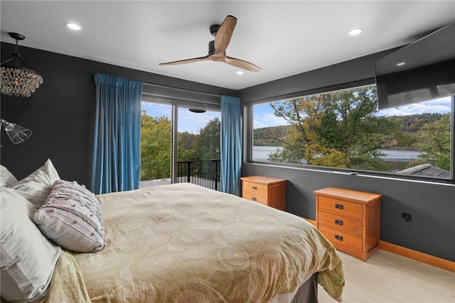 carpeted bedroom featuring access to exterior and ceiling fan