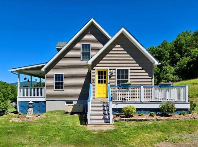 back of house with a lawn