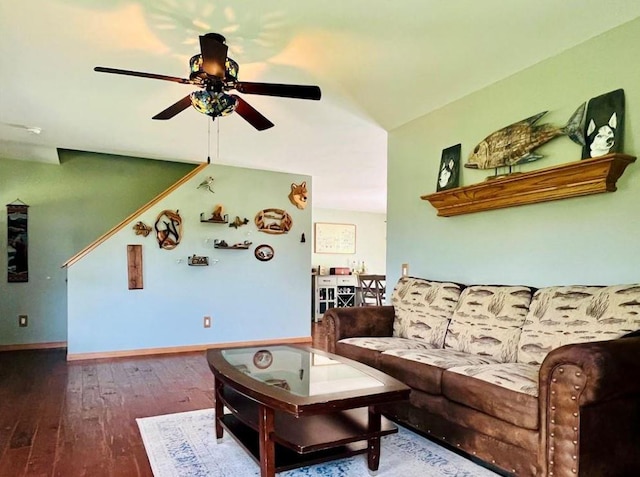 living room featuring hardwood / wood-style flooring and ceiling fan