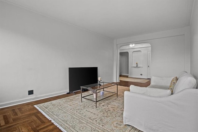 living room featuring dark parquet floors